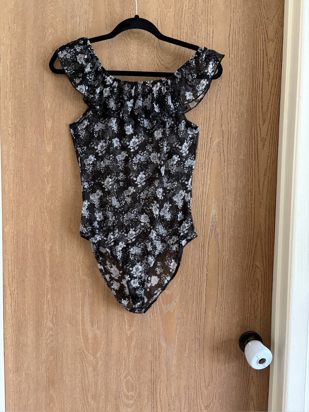Women’s Black Floral One-Piece with Ruffle Neckline
